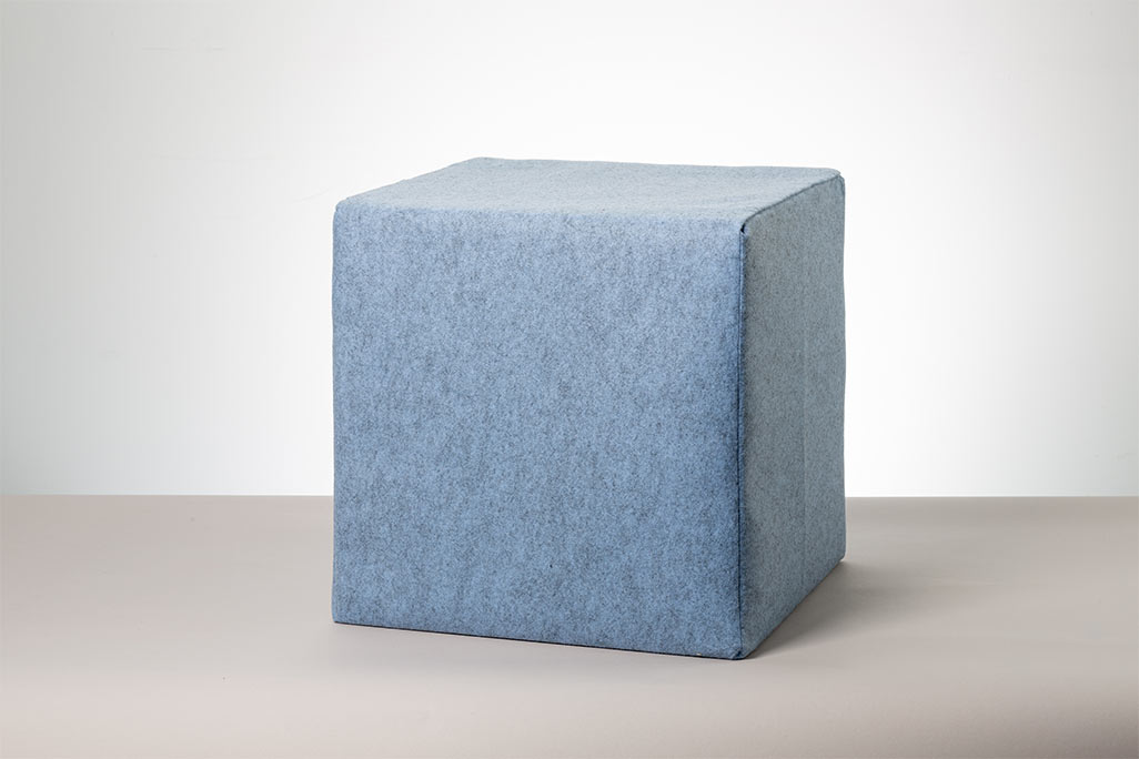 Blue seat cube photographed against a white background.