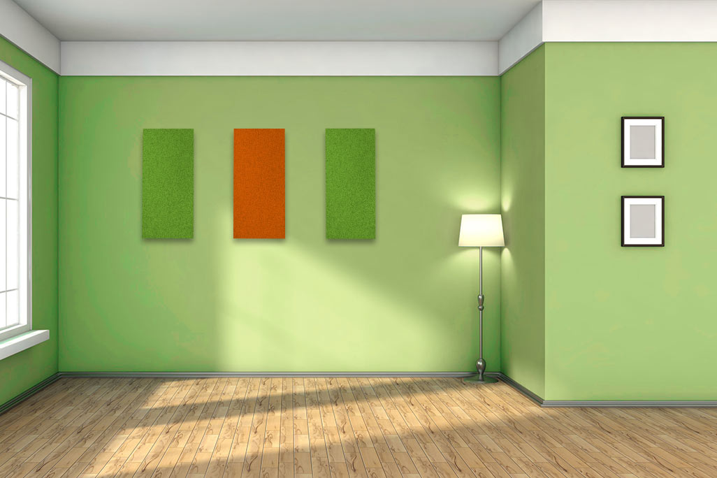 Cozy room with green walls and orange and green acoustic absorbers made of PES fleece on the wall